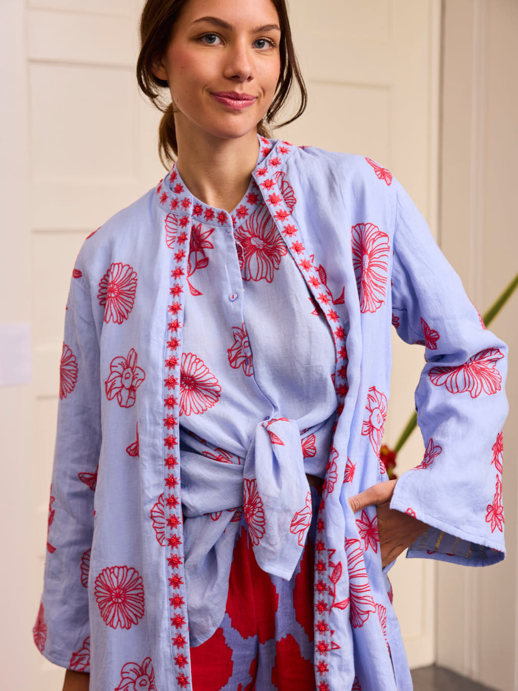 Chili Pepper Coat Red Flowers on Pastel Blue