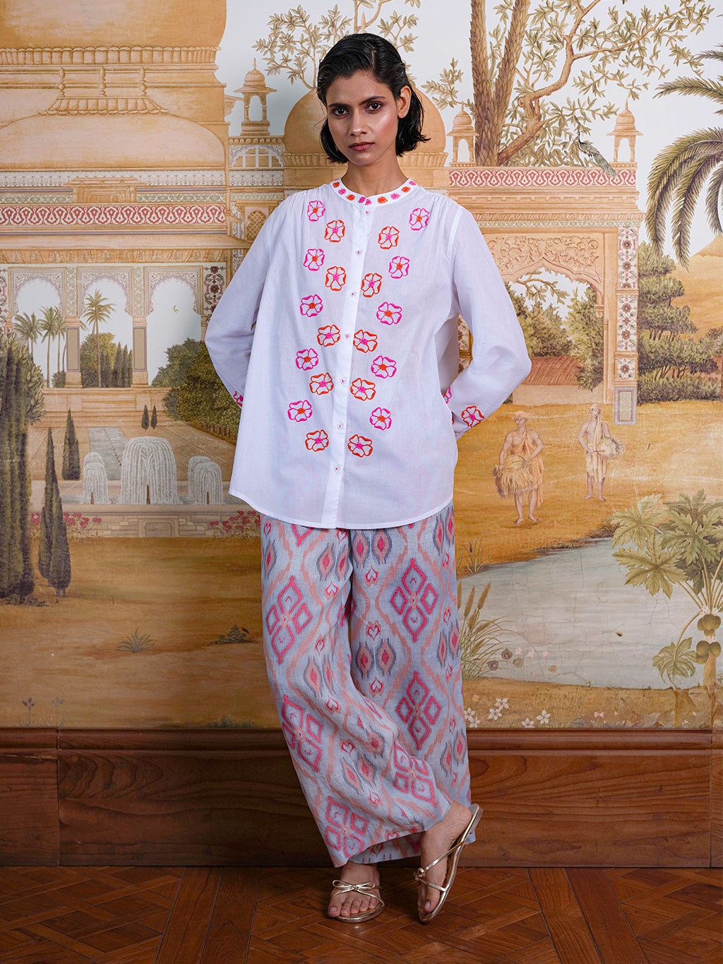 Model showcasing the fluid movement and sophisticated, easy fit of the Fennel linen pants in a resort setting.