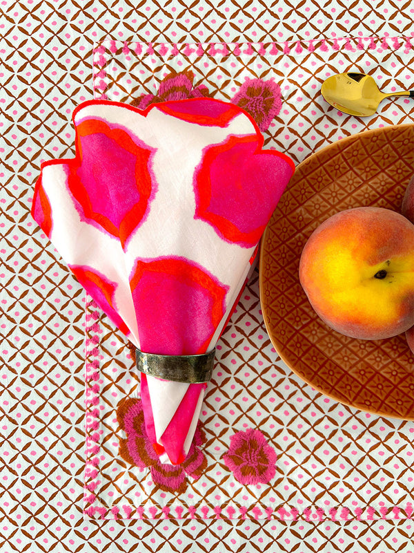 close-up of ikat pink orange print on premium linen napkin