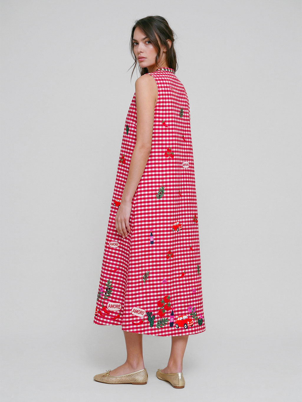 A-line sleeveless midi dress in red and white gingham, blending Nimo’s minimalist silhouette with charming Italian embroidery.