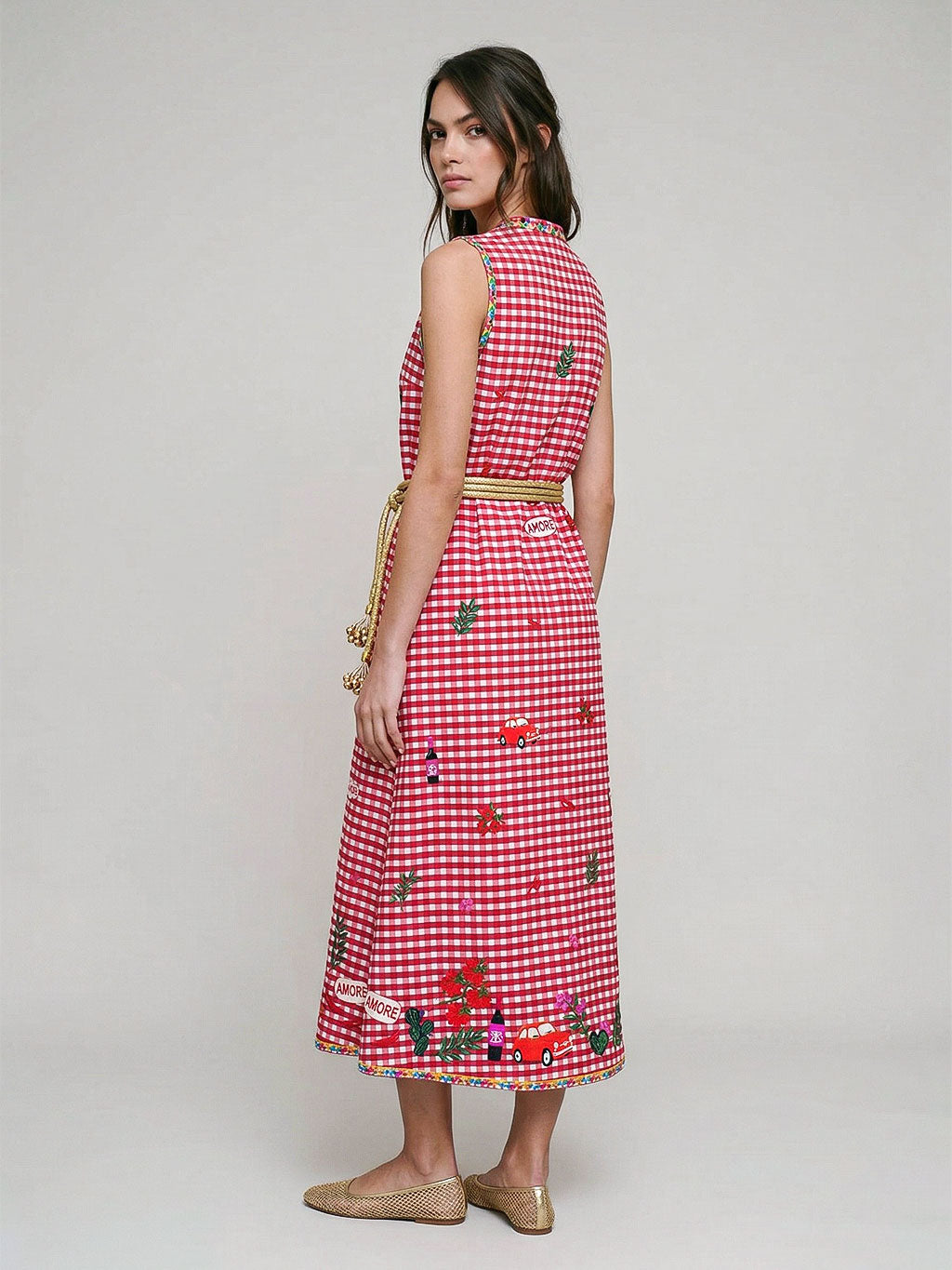 Artisanal craftsmanship meets Mediterranean charm in this limited-edition Nimo cotton dress with vibrant red embroidery.