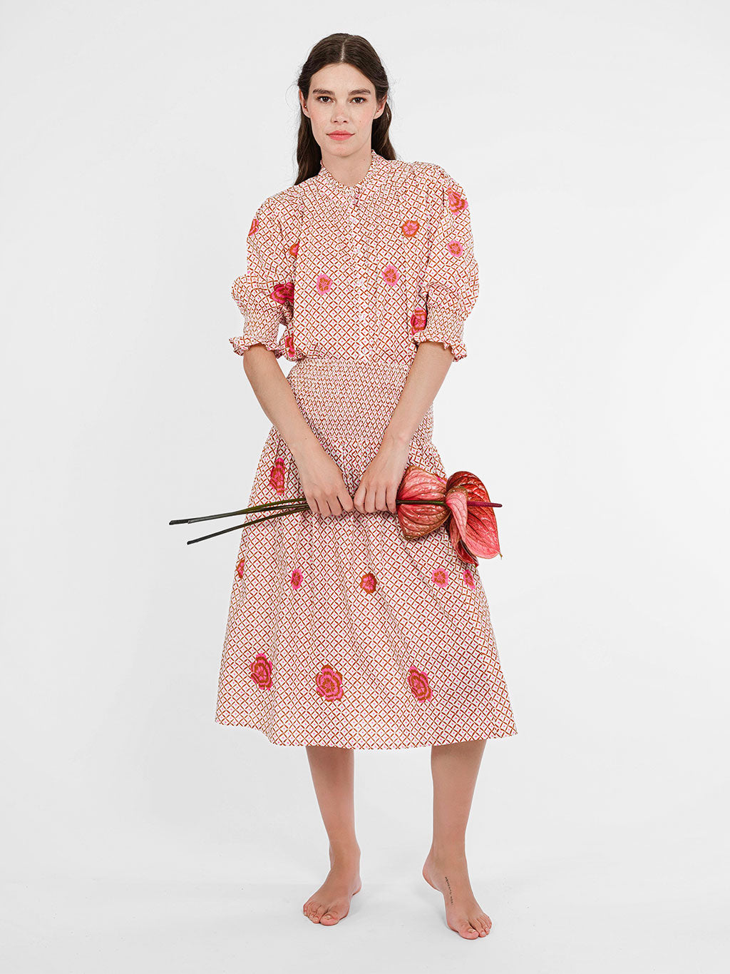 Model showcasing the refined, modest silhouette of the Bergamot blouse, perfectly tucked for a sleek resort look.