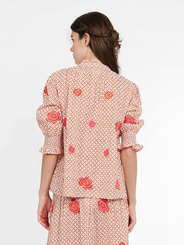 Rear view of the Bergamot blouse showcasing the voluminous puffed sleeves and the placement of floral embroidery.