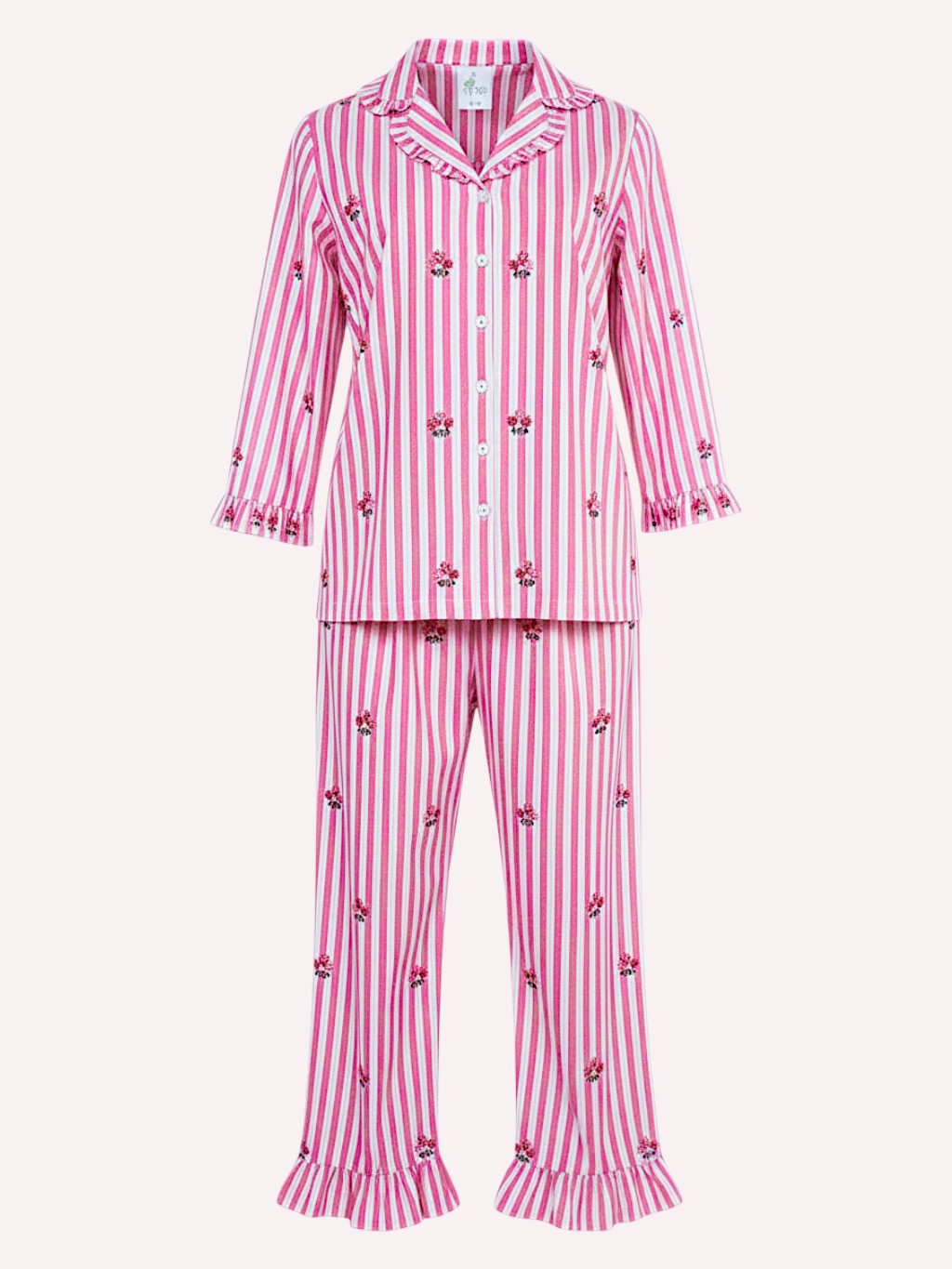 a luxury Nimo With Love two-piece girls' pajama set featuring pink and white vertical stripes with small embroidered floral motifs and ruffled trim on the collar, cuffs, and pant hems, shown against a plain light background.