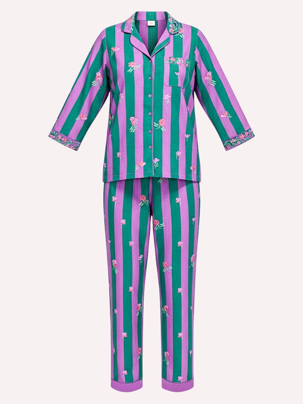 A luxury Nimo With Love two-piece pajama set featuring a long-sleeve button-up top and matching pants with vertical pink and teal stripes and small floral prints, shown on a light beige background.