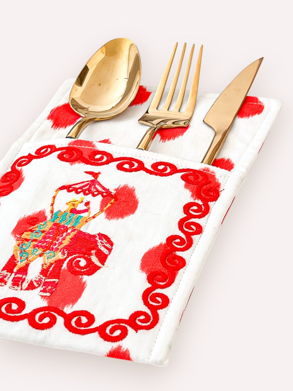 Luxury dining decor featuring traditional elephant motif embroidery
