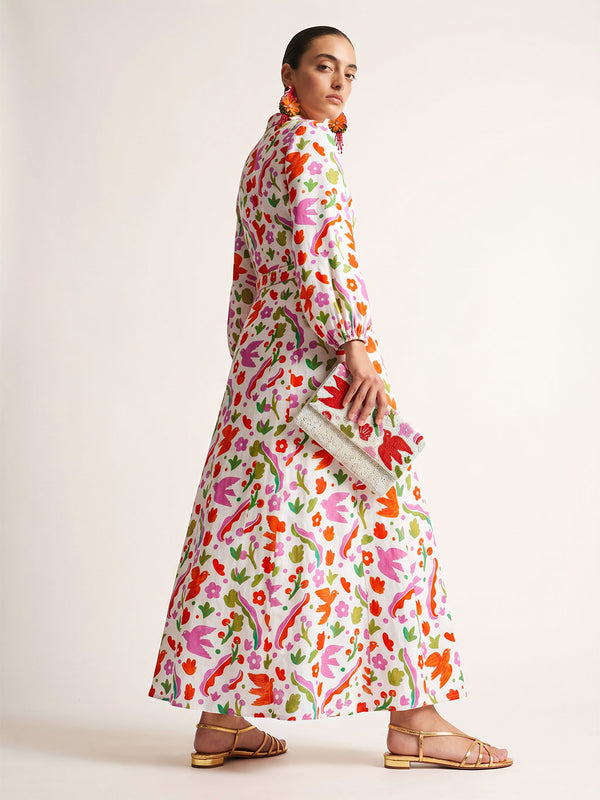 Side view of the ankle-length Marigold dress showcasing its fluid linen drape and hidden pocket design.