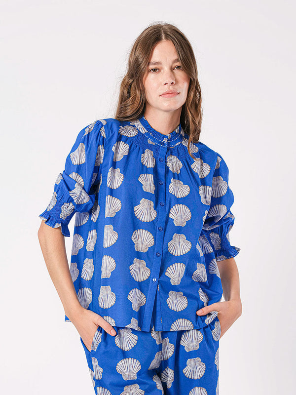 Royal button-down blue blouse with seashell print and stand-up collar