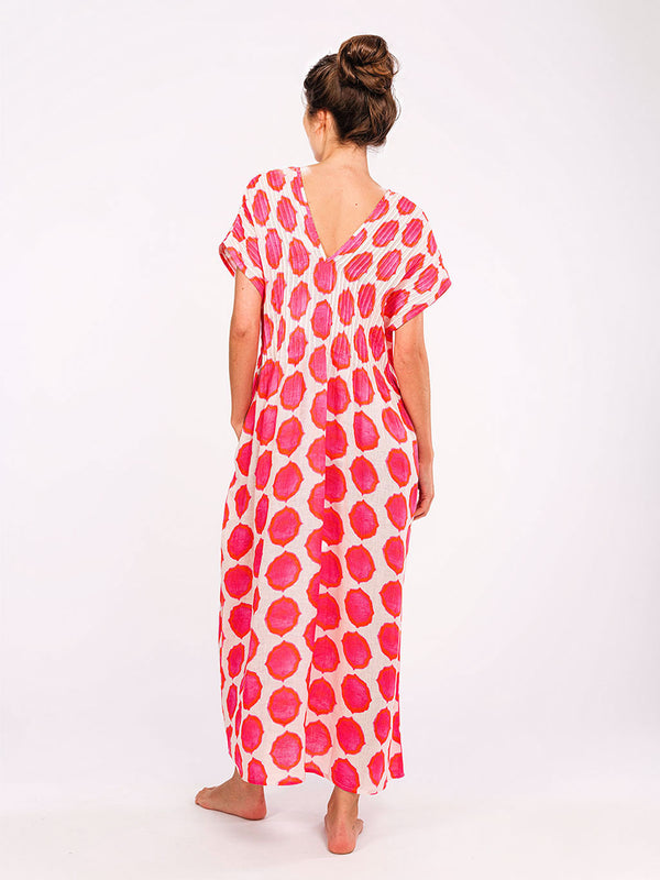 Back view of the Sea Cale dress with elegant V-neckline and pleats