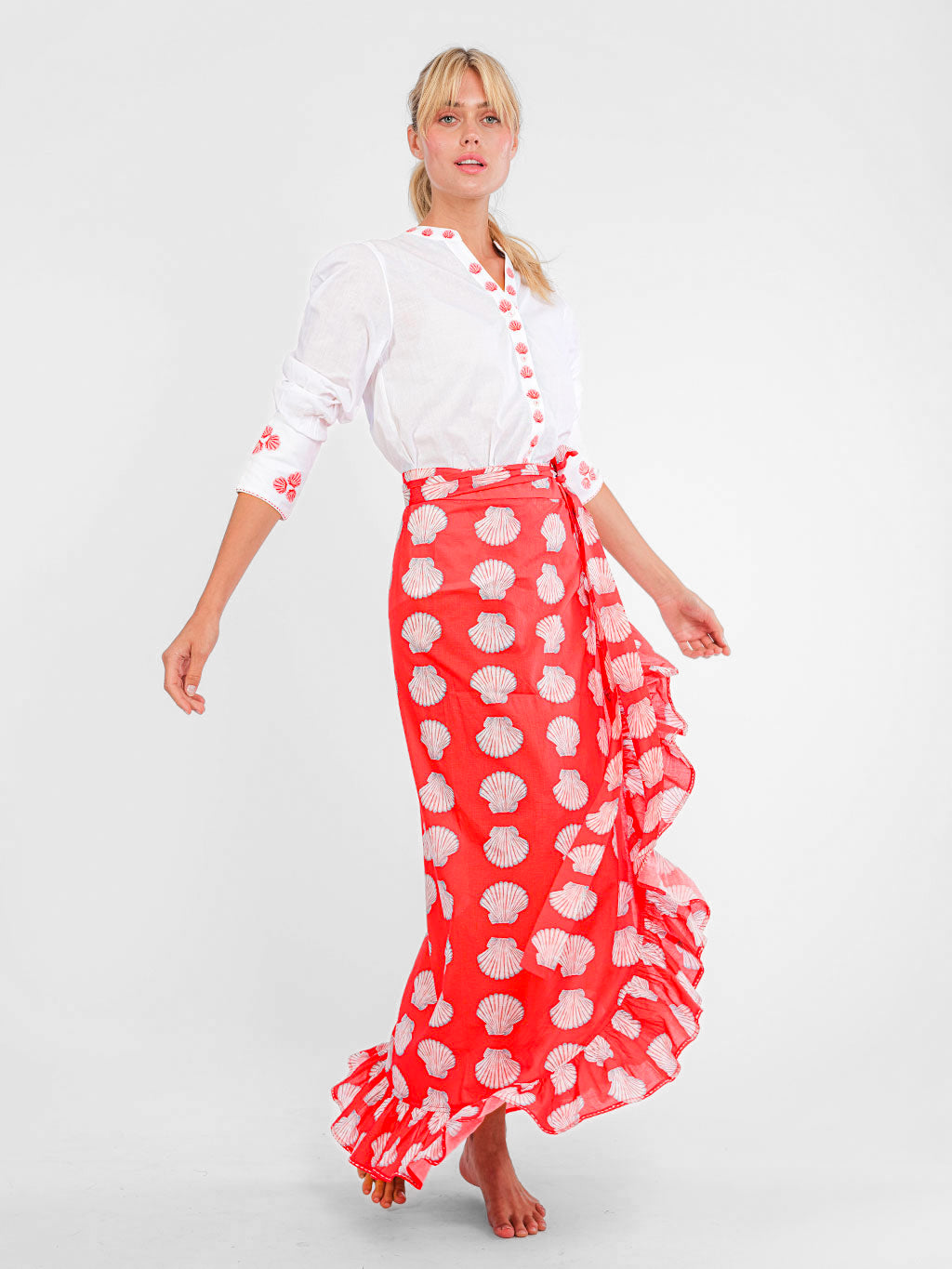 Nimo With Love maritime fashion: embroidered shell blouse in white and red styled with a shell print maxi wrap skirt