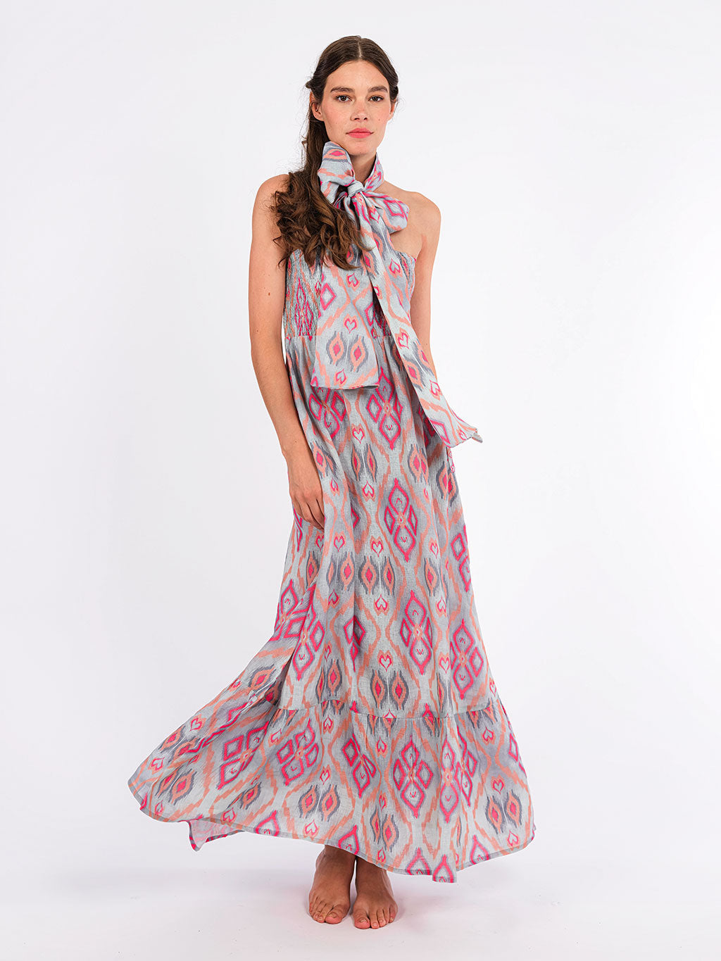 Model showcasing the breezy, elegant movement of the Caraway linen dress, perfect for a high-summer event.