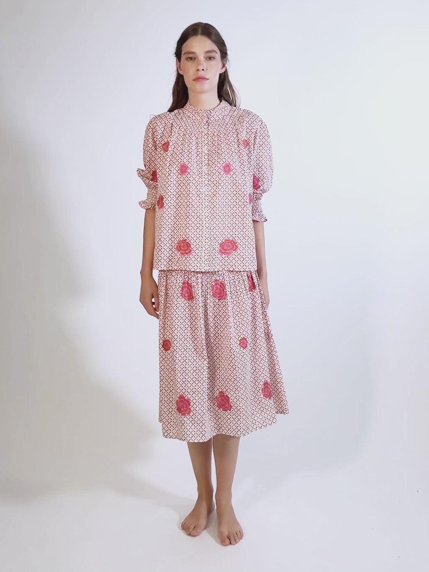 Video of the knee-length Lads Love skirt by Nimo With Love in mustard dot-ikat organic cotton with pink floral embroidery.