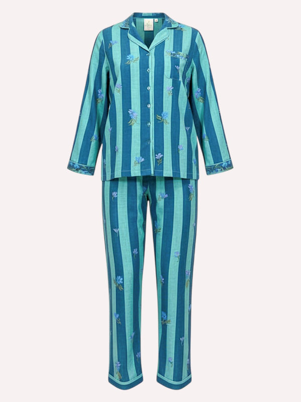 A Nimo With Love luxury two-piece pajama set featuring a long-sleeve button-up top and matching pants, both decorated with vertical stripes in shades of teal, blue, and mint green, accented with small blue floral motifs.